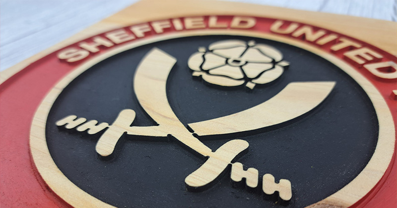 Why is the sheffield united badge so unique (Compare it to other club crests)